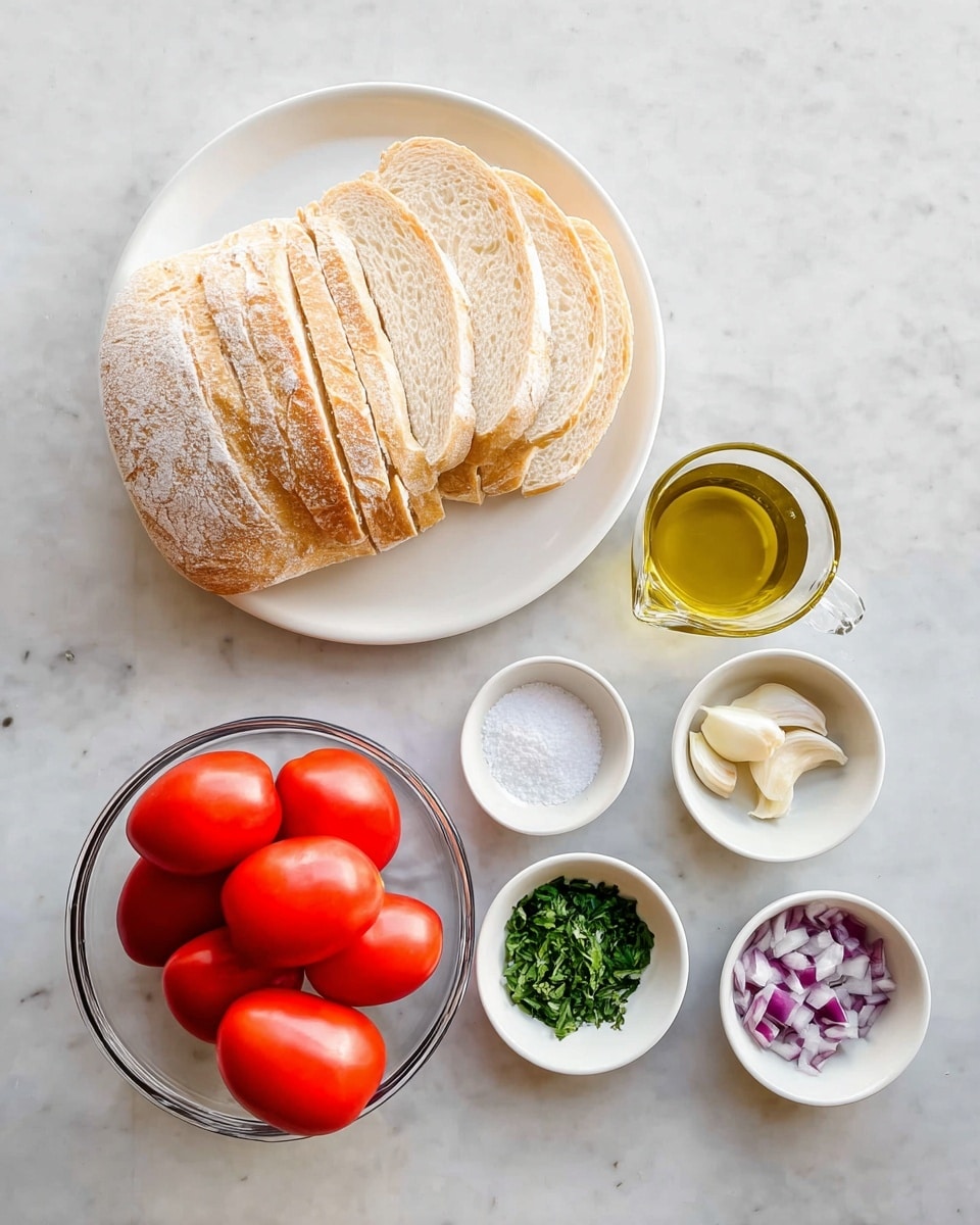 The image shows a simple arrangement of ingredients on a white marbled surface. At the center top, there is a white plate filled with two loaves of sliced bread, each slice dusted lightly with flour, showing a soft white inside and a golden-brown crust. Below the plate, in the center, there is a clear glass bowl filled with bright red Roma tomatoes. To the right of the tomatoes, there is a small clear glass measuring cup with golden yellow olive oil. Surrounding the tomatoes and olive oil, there are five small white dishes: one with coarse salt at the top left, one with finely chopped red onion below the salt, one with fresh green basil leaves to the right of the garlic, a few peeled garlic cloves in a dish near the bottom center, and one with chopped fresh thyme near the bottom left. The colors are vibrant, with the reds, greens, and yellows contrasting against the neutral white and light surface. photo taken with an iphone --ar 4:5 --v 7