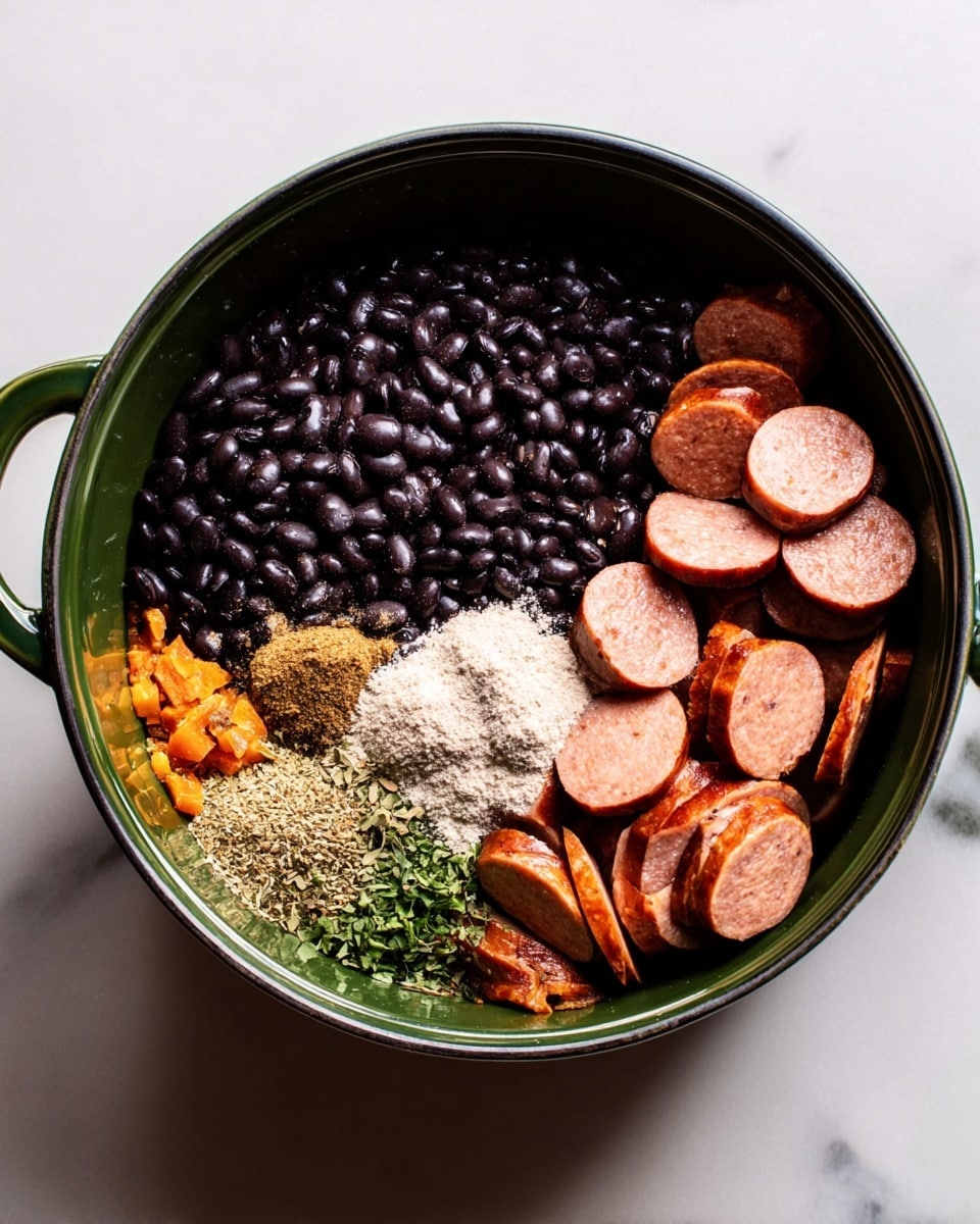 A white bowl filled with a thick dark brown bean stew as the base layer, containing whole black beans and chunks of green and orange bell peppers. There are five browned sausage slices placed evenly on top of the stew. Fresh green cilantro leaves and small diced white onion pieces are sprinkled over the stew and sausage slices. In the center, there is a dollop of white sour cream with a few diced red onion bits on it. A shiny metal spoon is placed on the left inside the bowl. The bowl is set on a white marbled surface. Photo taken with an iphone --ar 4:5 --v 7