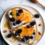 Honey Roasted Peach Toast with Greek Yogurt, Blackberries, and Almonds Recipe