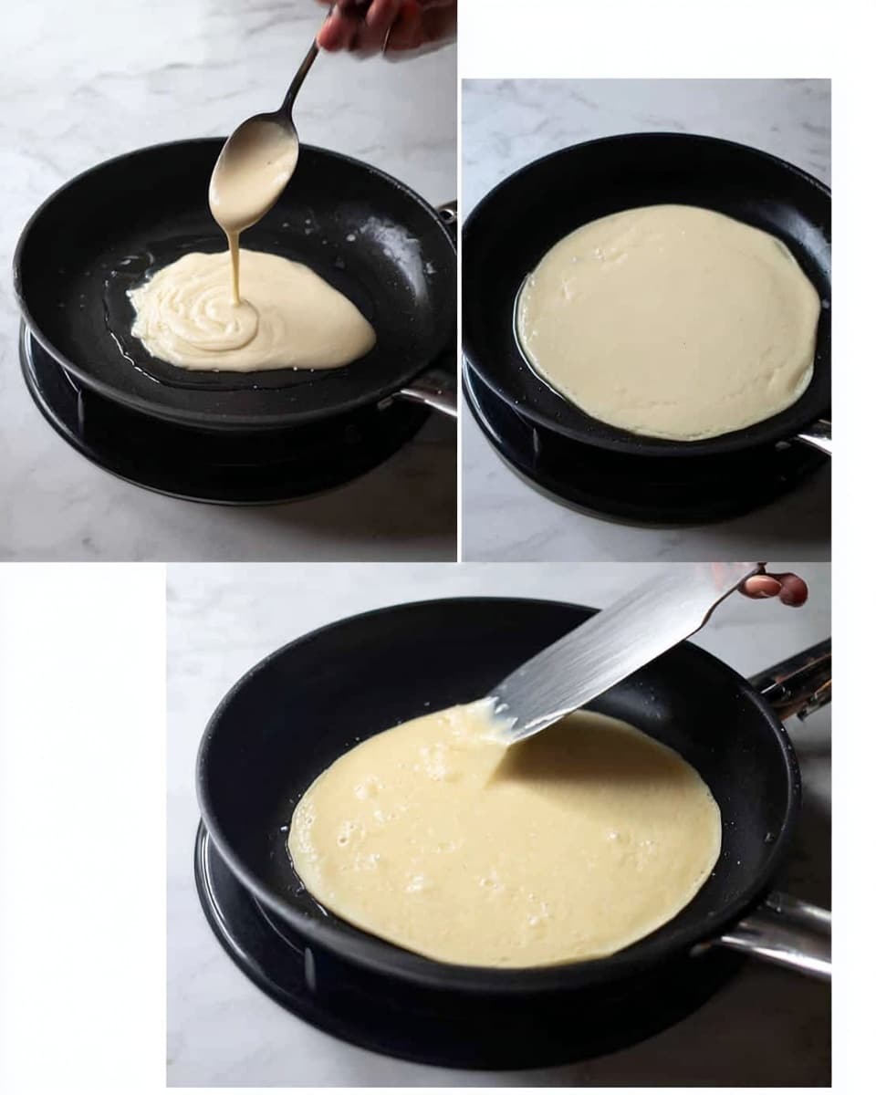 The images show the process of cooking a single pancake layer in a black frying pan on a stove. The pancake batter is a smooth light beige color; in the first image it is being poured from a spoon into the pan where a thin layer of oil shines under the batter. In the second image, the pancake spreads thinly and evenly in the pan, pale and smooth with a few tiny bubbles starting to form. In the third image, a woman's hand uses a metal spatula to gently lift the edge of the pancake, showing its thin texture and soft underside, while the pancake remains flat on the pan. The background is a white marbled texture. Photo taken with an iphone --ar 4:5 --v 7